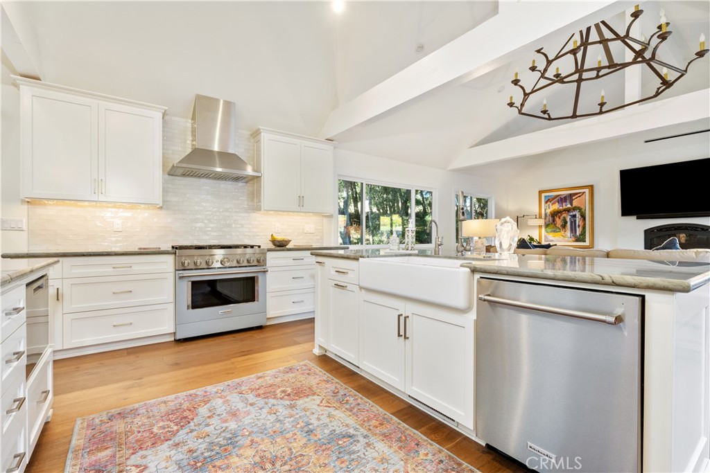 1545 Willow Creek Road Paso Robles, CA 93446 - Photo 14 of 52 Spacious kitchen featuring upgraded appliances, blending a warm farmhouse aesthetic with timeless modern finishes.
