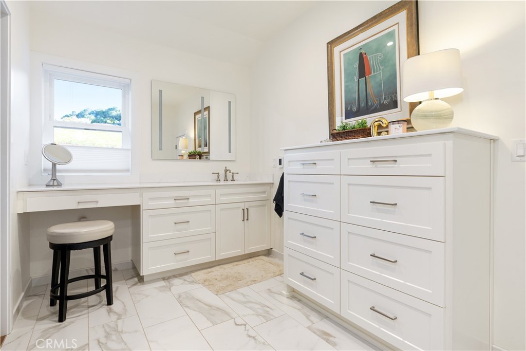 1545 Willow Creek Road Paso Robles, CA 93446 - Photo 25 of 52 Elegant tile finishes and heated flooring elevate the first ensuite into a spa-like experience.