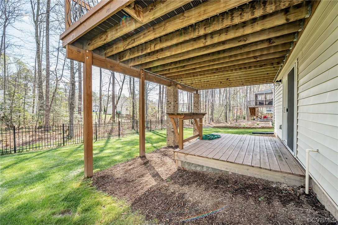 719 Vickilee Road Chesterfield, VA 23236 - Photo 39 of 40 Deck area outside of the basement. Built in table was used for sanding and painting projects but could also be a great potting bench!