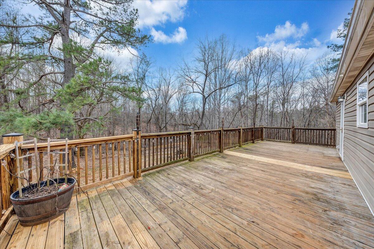 5398 Goodview Road Goodview, VA 24095 - Photo 30 of 59 a view of a balcony with wooden floor and fence
