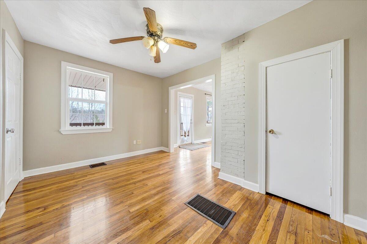 5398 Goodview Road Goodview, VA 24095 - Photo 8 of 59 a view of an empty room and wooden floor