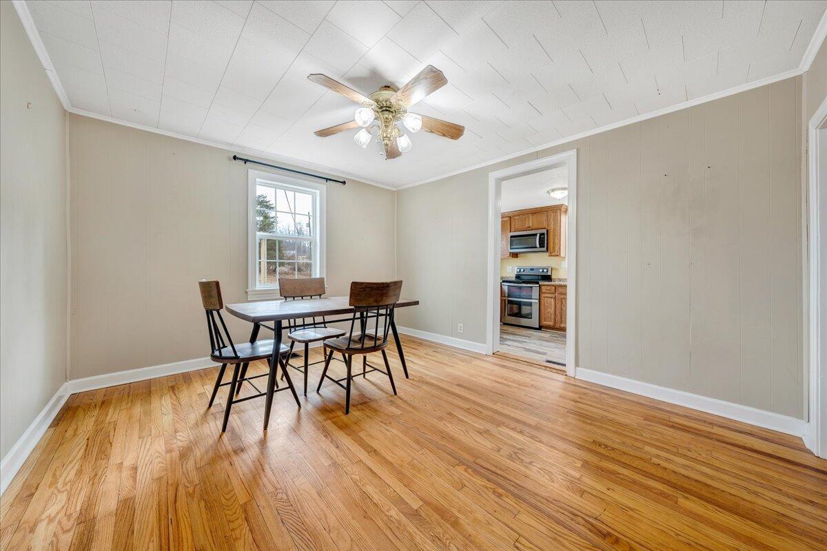 5398 Goodview Road Goodview, VA 24095 - Photo 9 of 59 a view of a dining room with furniture and wooden floor
