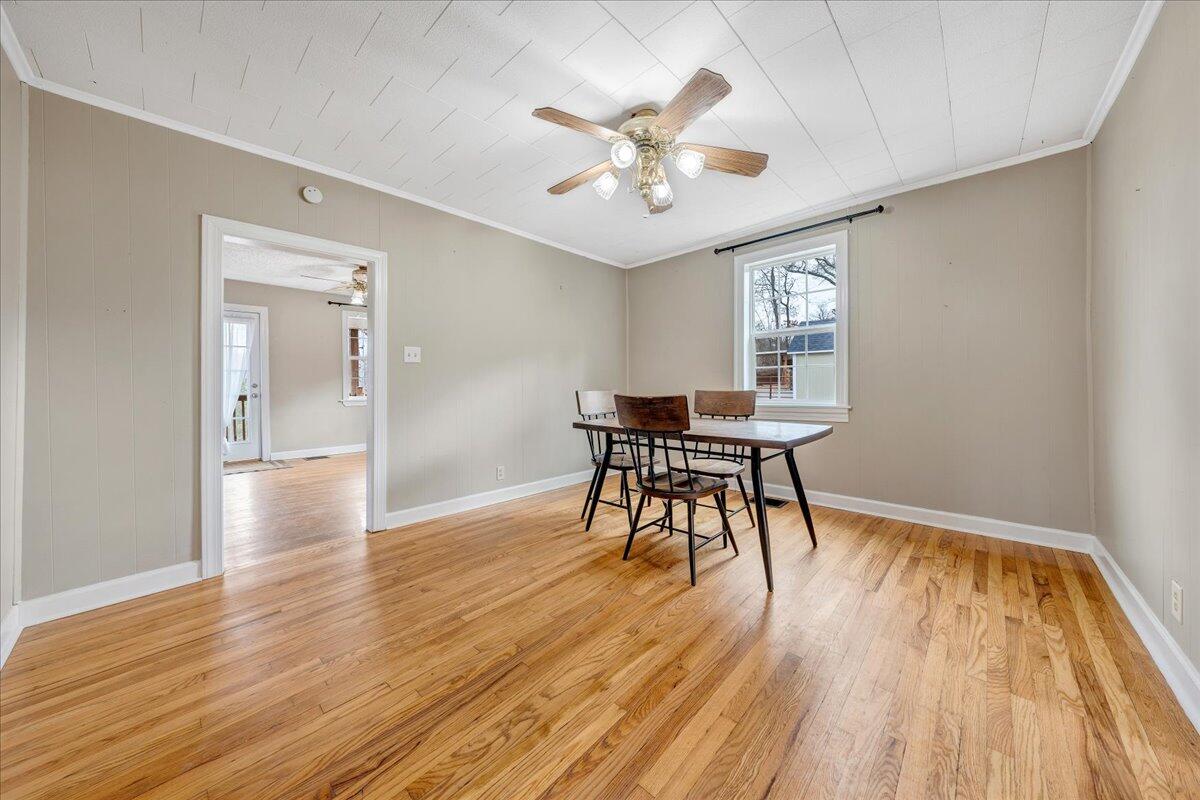 5398 Goodview Road Goodview, VA 24095 - Photo 10 of 59 a view of a dining room with furniture and wooden floor