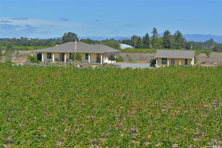 4721 Hall Road Santa Rosa, CA 95401 - Photo 1 of 1 a front view of a house with a yard