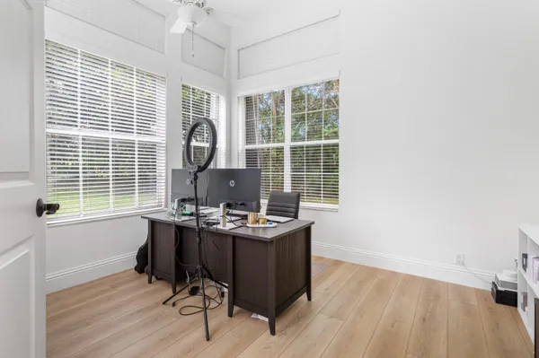 a living room with a large window and a table