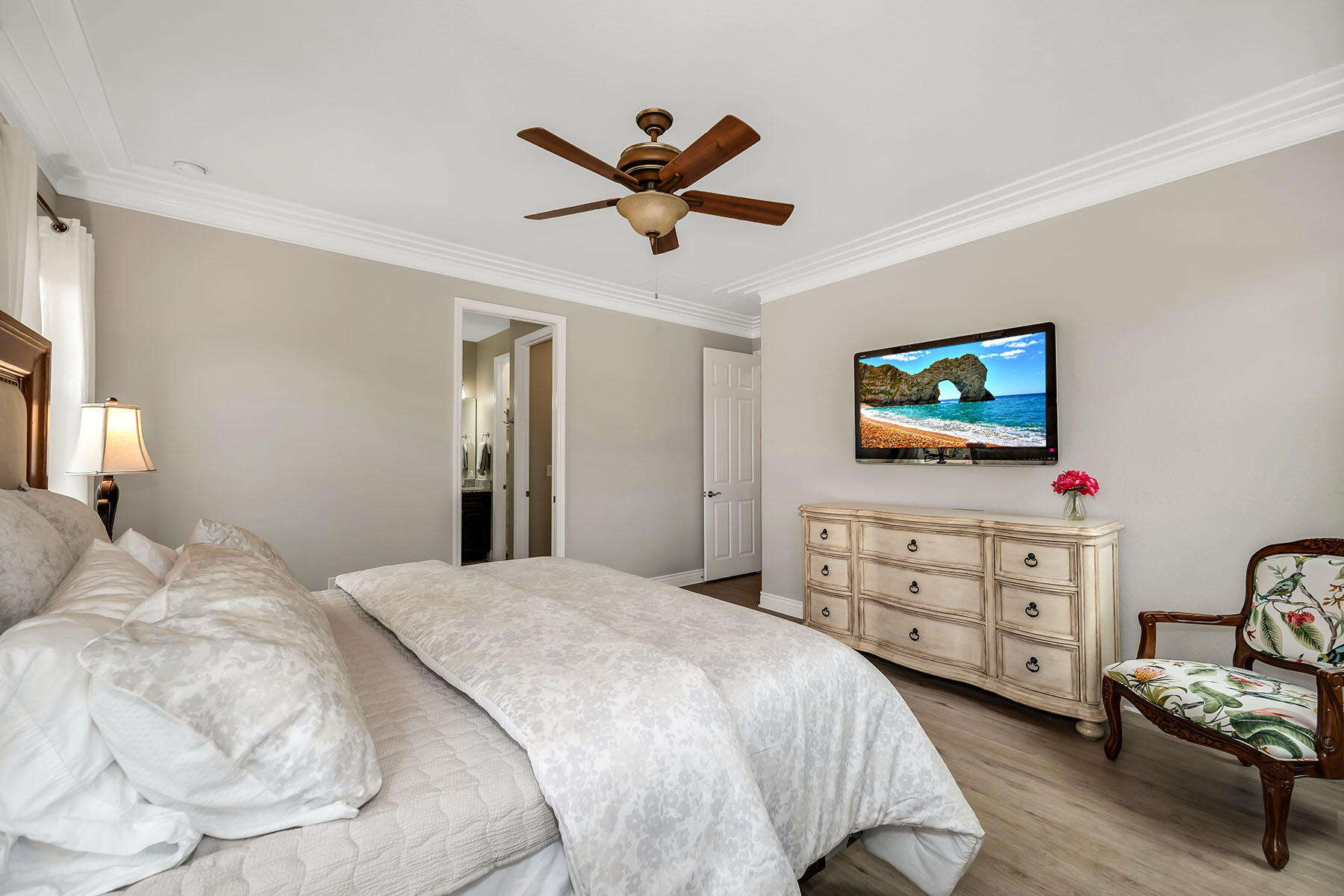 9066 Albion Lane North, Unit 5101 Naples, FL 34113 - Photo 19 of 48 a bedroom with a bed and a dresser