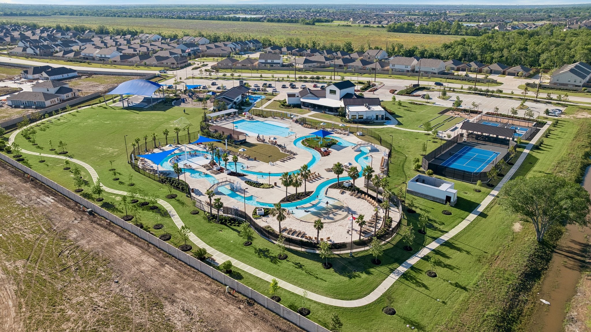 10227 Whitney Reach Drive Rosharon, TX 77583 - Photo 9 of 28 Aerial View of Sierra Vista Amenties Village with some much to offer, including pool, splash pad, lazy river, pickleball and tennis and more.