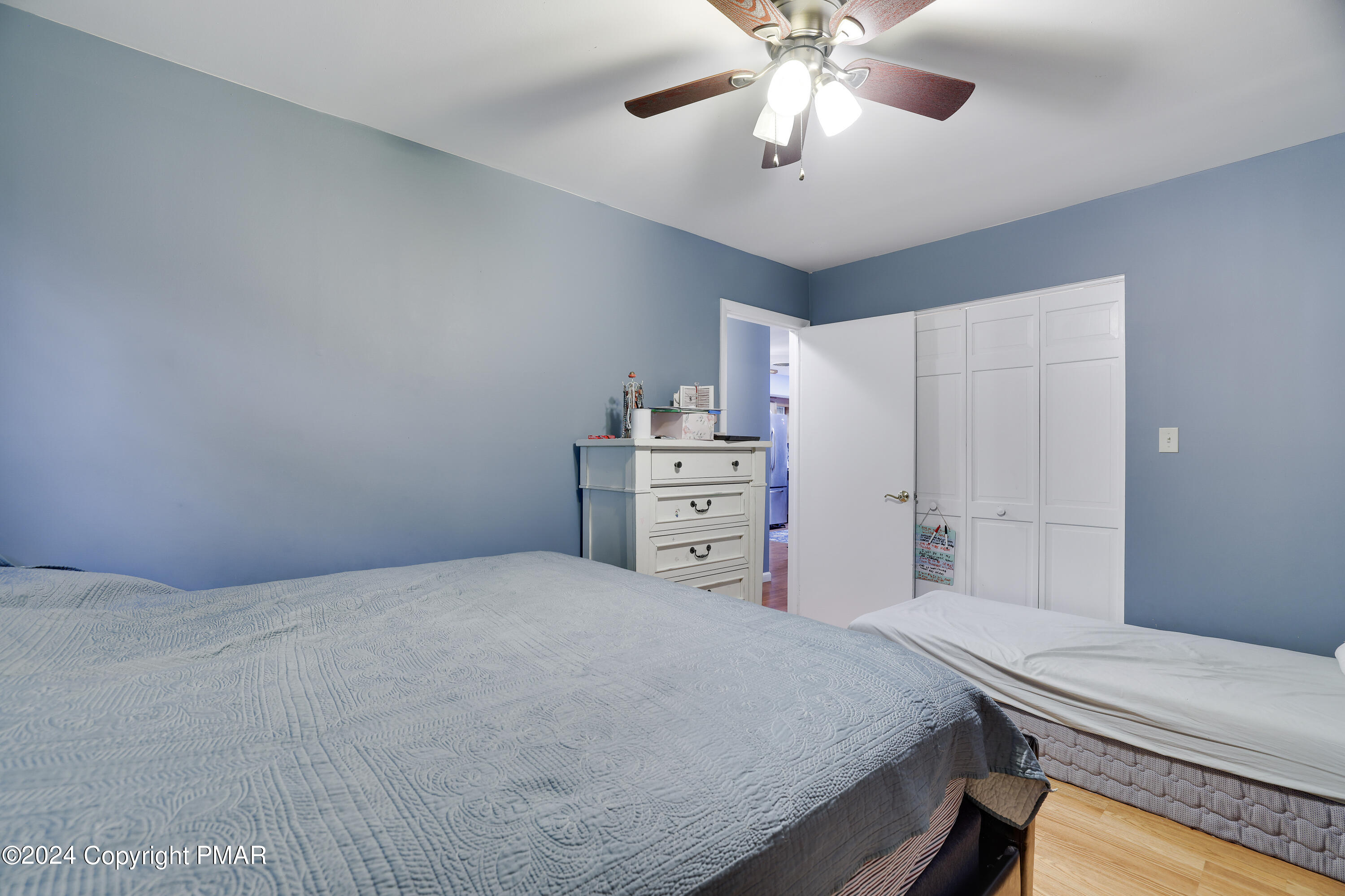 9 Jewel Street Roseto, PA 18013 - Photo 11 of 23 a bedroom with a bed and a chandelier