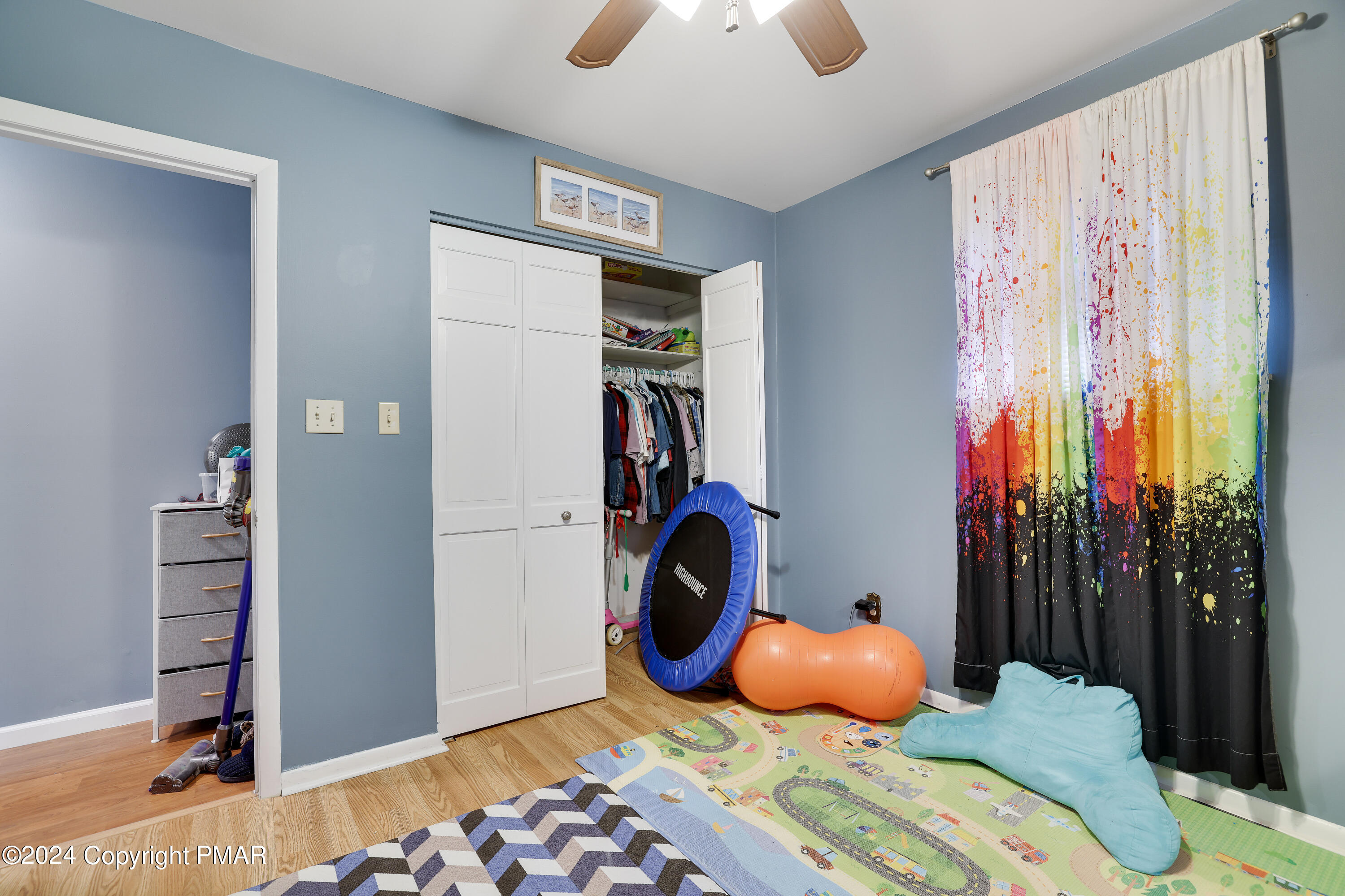 9 Jewel Street Roseto, PA 18013 - Photo 13 of 23 a bedroom with a bed and a chandelier