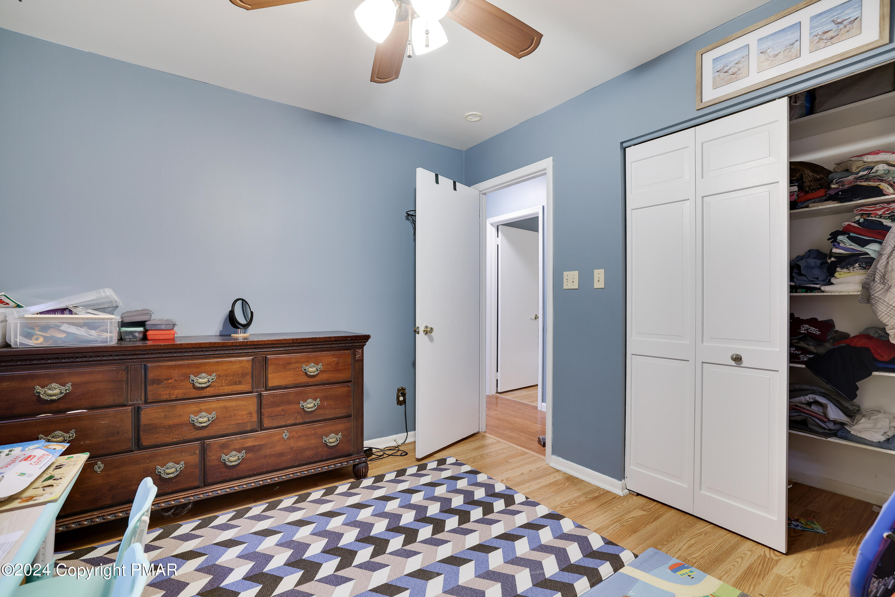 9 Jewel Street Roseto, PA 18013 - Photo 14 of 23 a room with a dresser and a chandelier