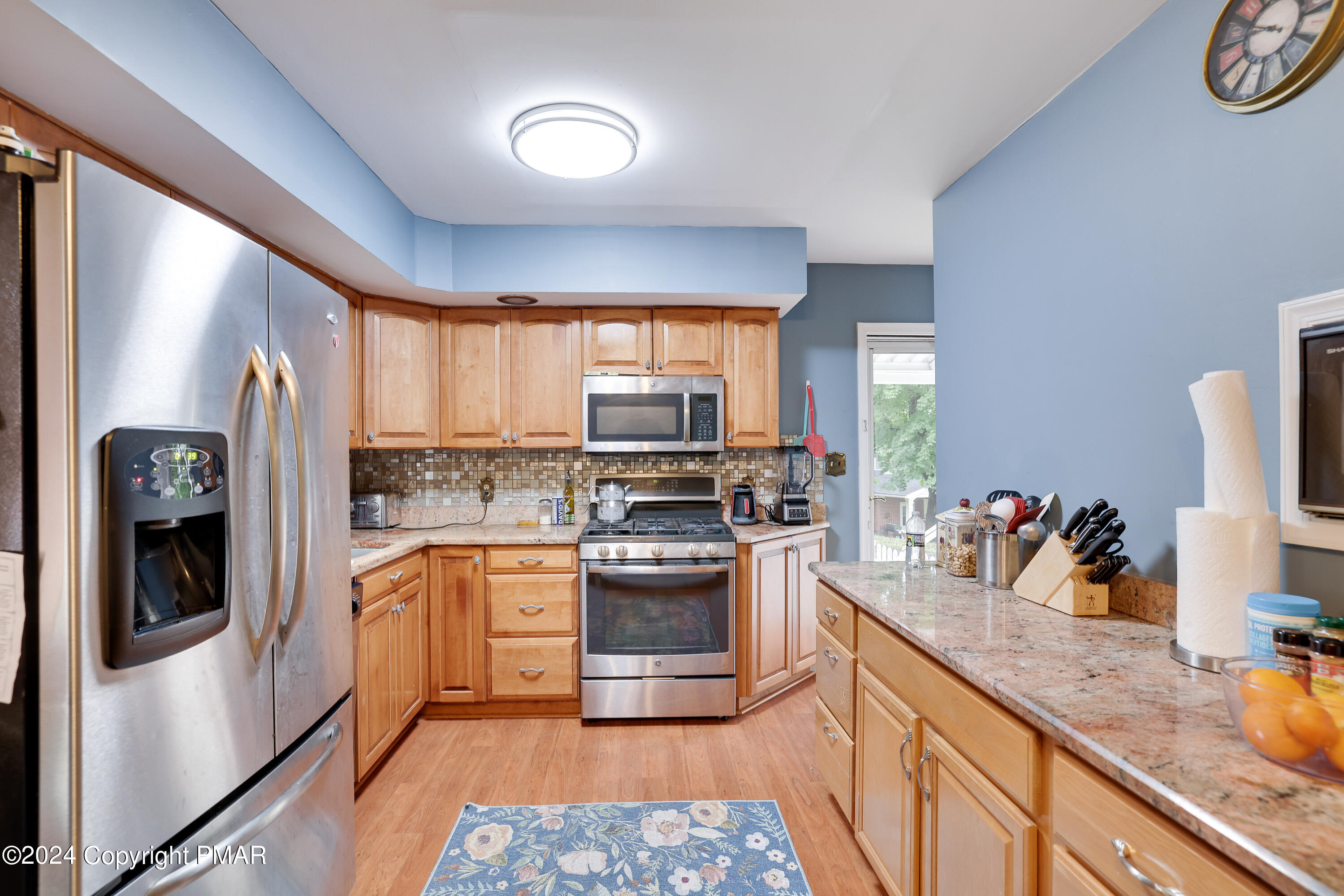 9 Jewel Street Roseto, PA 18013 - Photo 6 of 23 a kitchen with stainless steel appliances granite countertop a stove a sink and a refrigerator