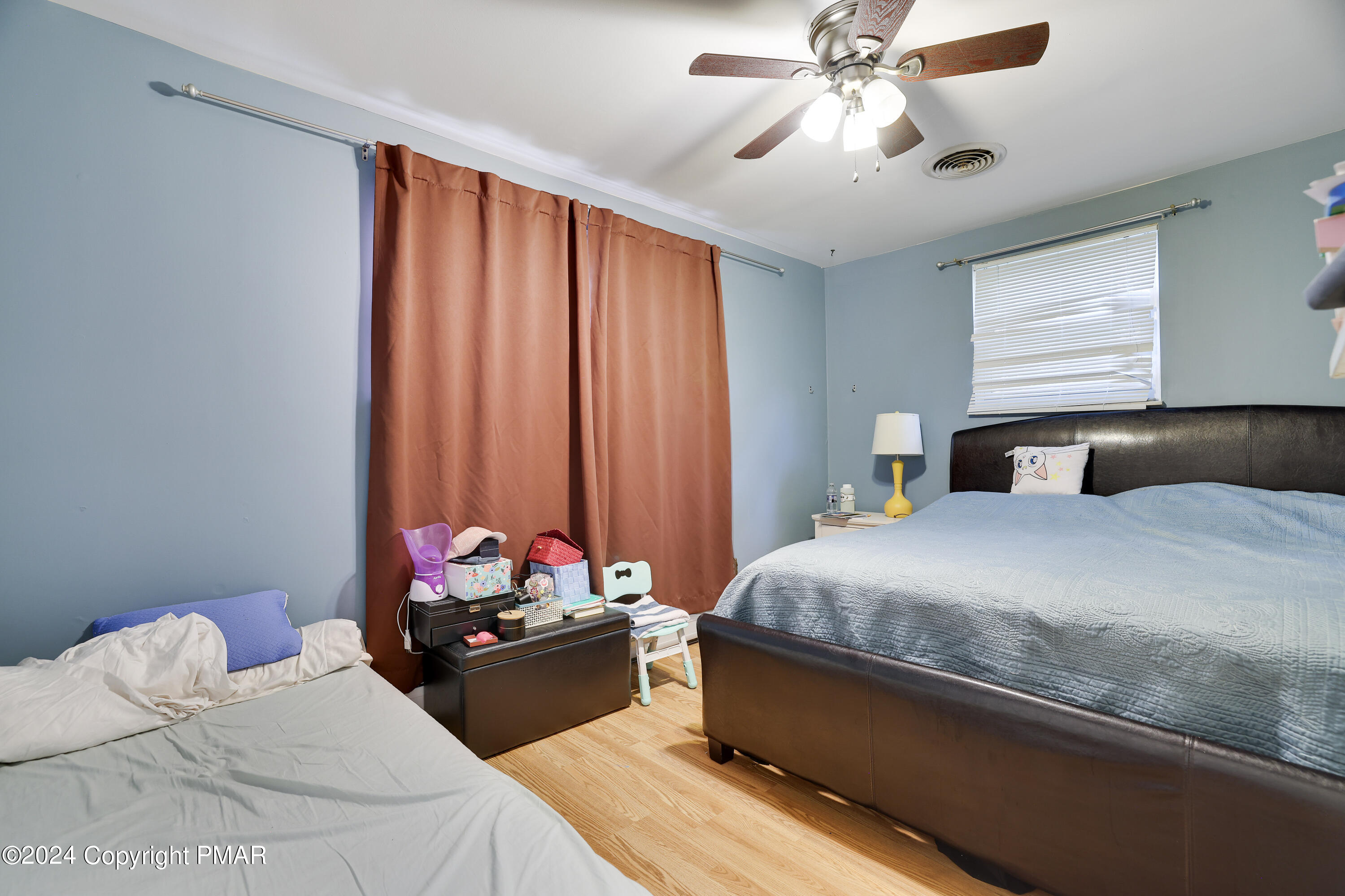 9 Jewel Street Roseto, PA 18013 - Photo 9 of 23 a bedroom with a bed and a chandelier