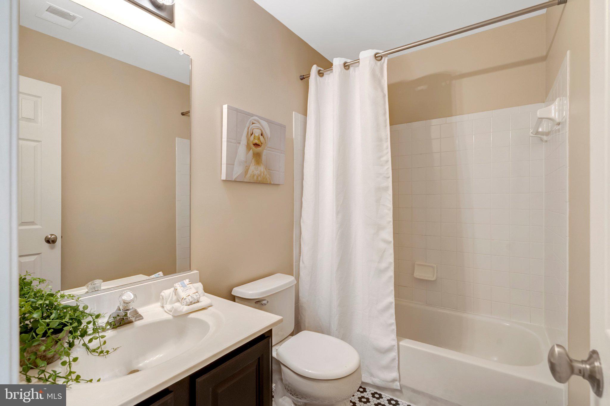 7706 Shadowcreek Terrace Springfield, VA 22153 - Photo 21 of 30 a bathroom with a sink and toilet
