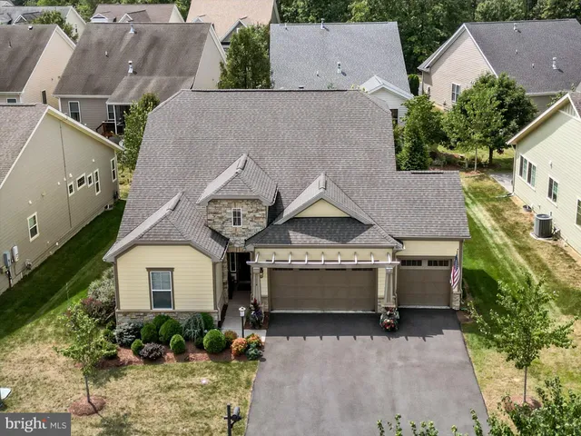 an aerial view of a house with a garden