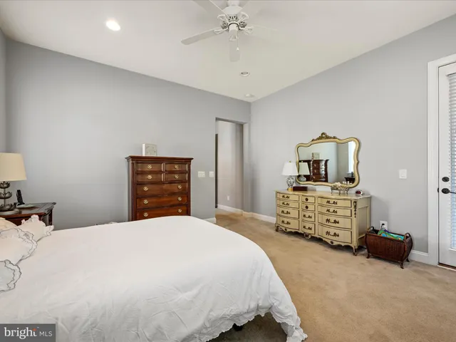 a view of walk in closet with clothes
