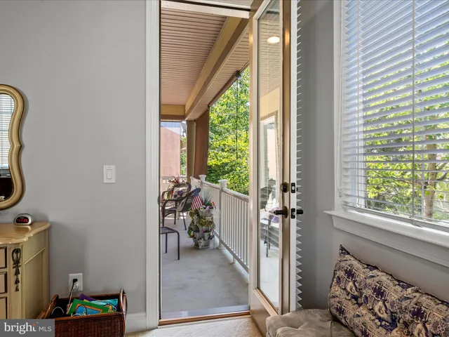a view of staircase with lots of frames on wall