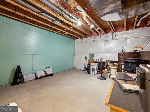 an aerial view of a house with a garden and lake view