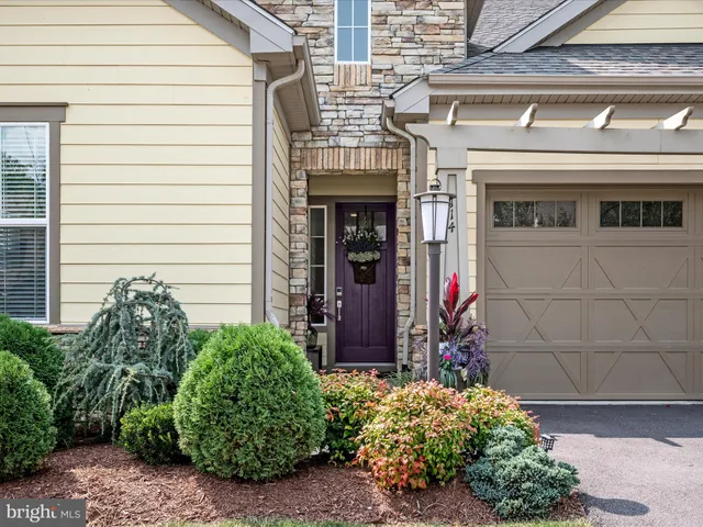 a view of front door and small plants
