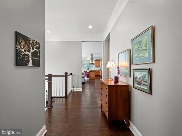 a bathroom with a granite countertop sink mirror vanity and toilet