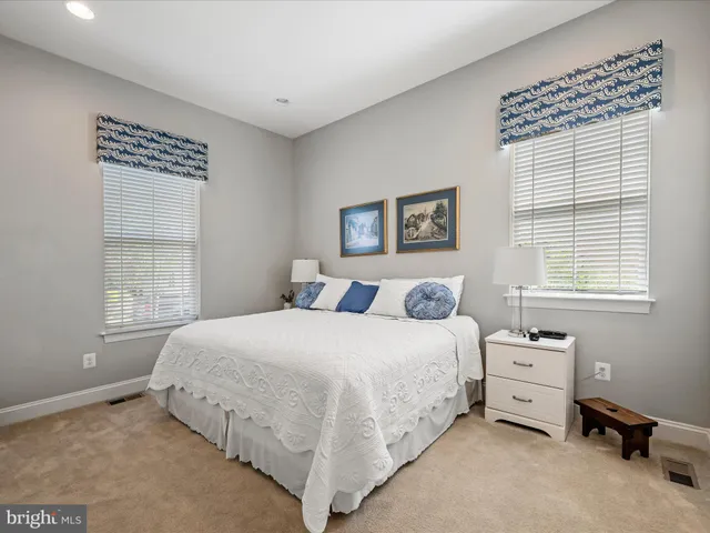 a living room with furniture or wooden floor and a large window