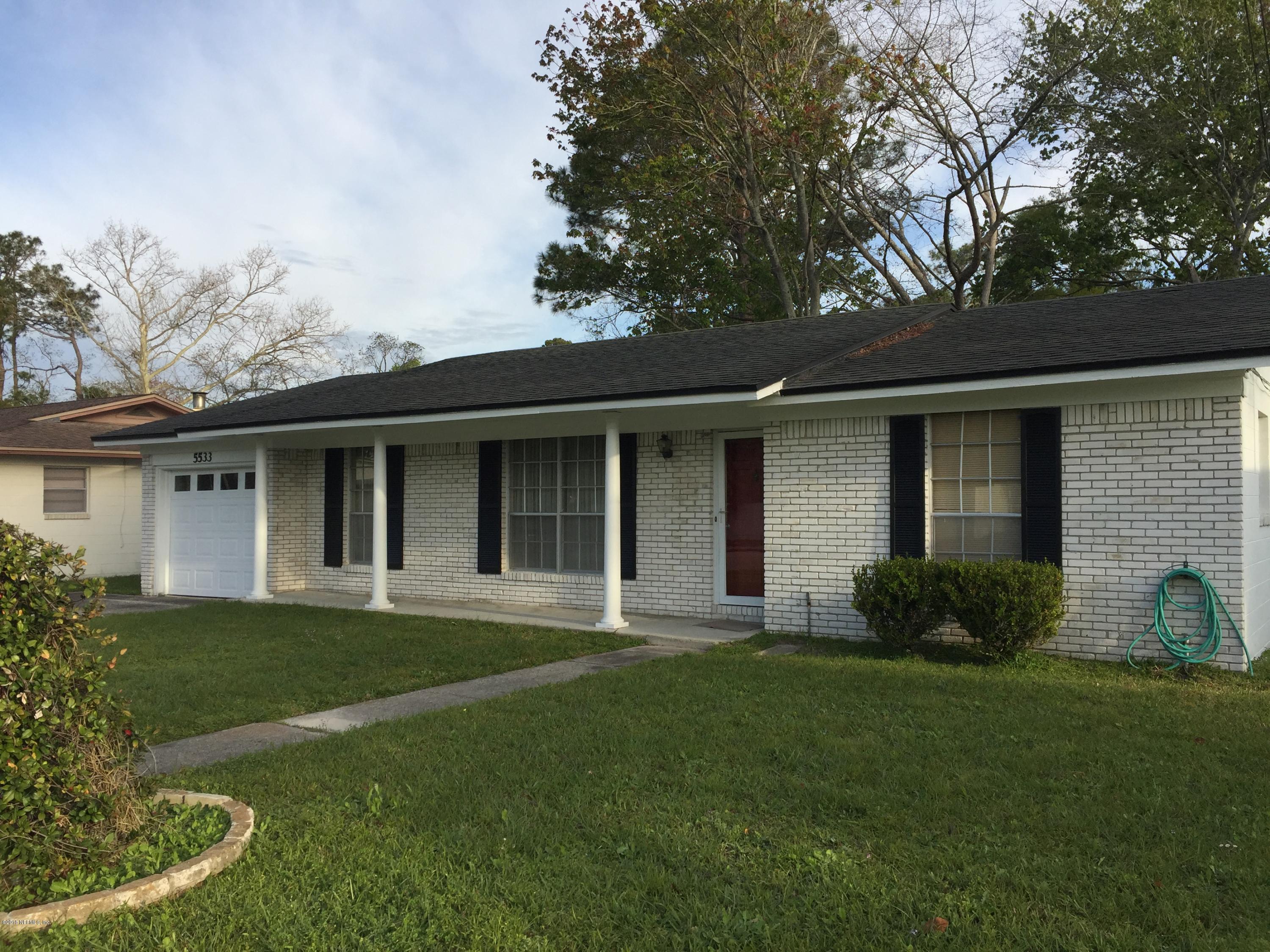 5533 Kennerly Road Jacksonville, FL 32207 - Photo 2 of 3 a front view of a house with a garden