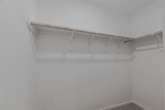 a view of a room with shelf on the wall