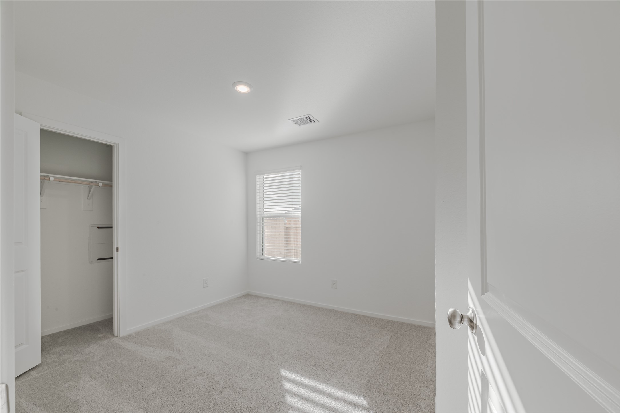 18023 Trepito Avenue New Caney, TX 77357 - Photo 15 of 20 a view of an empty room with a window