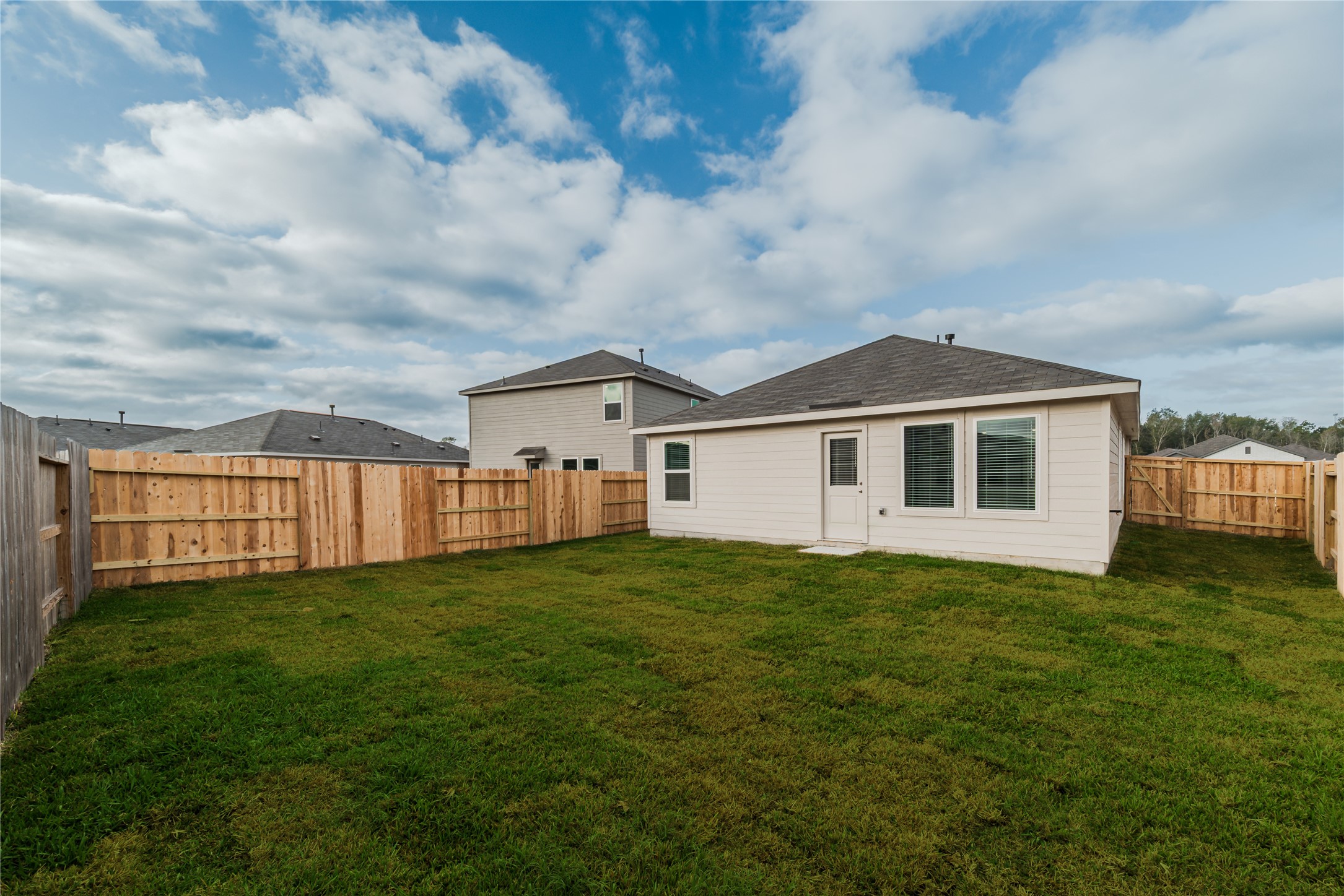 18023 Trepito Avenue New Caney, TX 77357 - Photo 20 of 20 a house view with a garden space