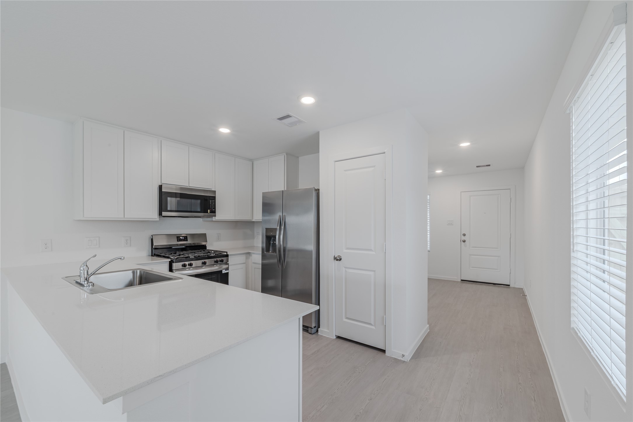 18023 Trepito Avenue New Caney, TX 77357 - Photo 6 of 20 a view of kitchen with stainless steel appliances refrigerator oven and cabinets
