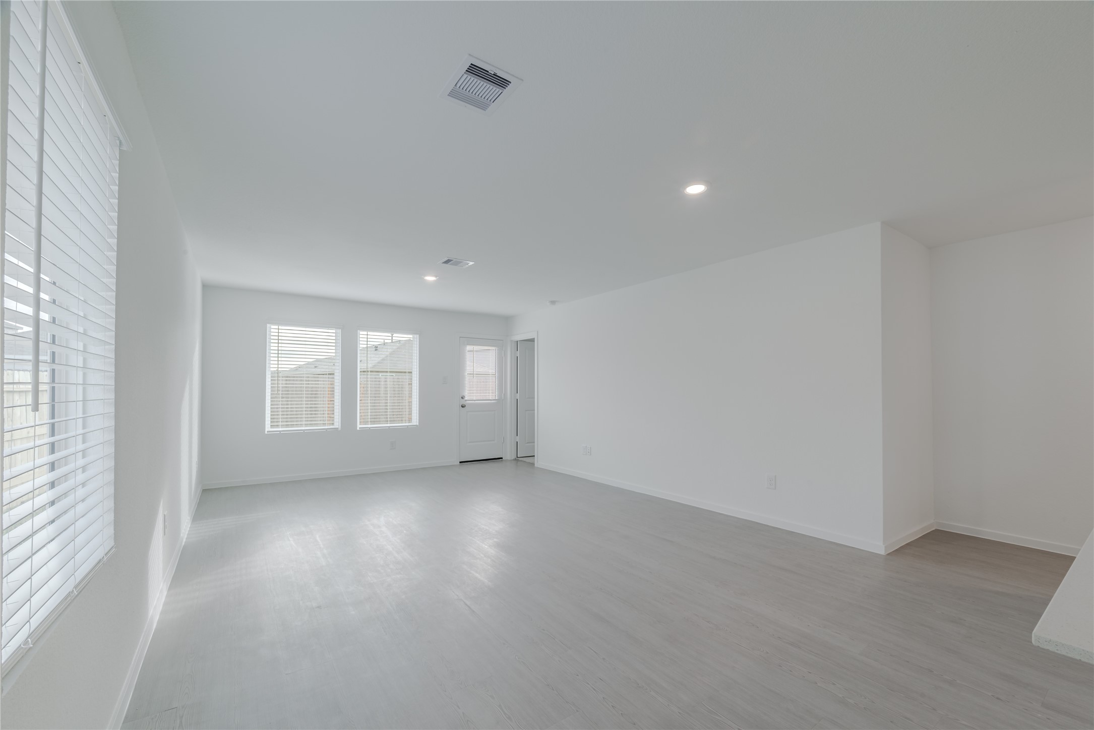 18023 Trepito Avenue New Caney, TX 77357 - Photo 7 of 20 an empty room with windows and entrance