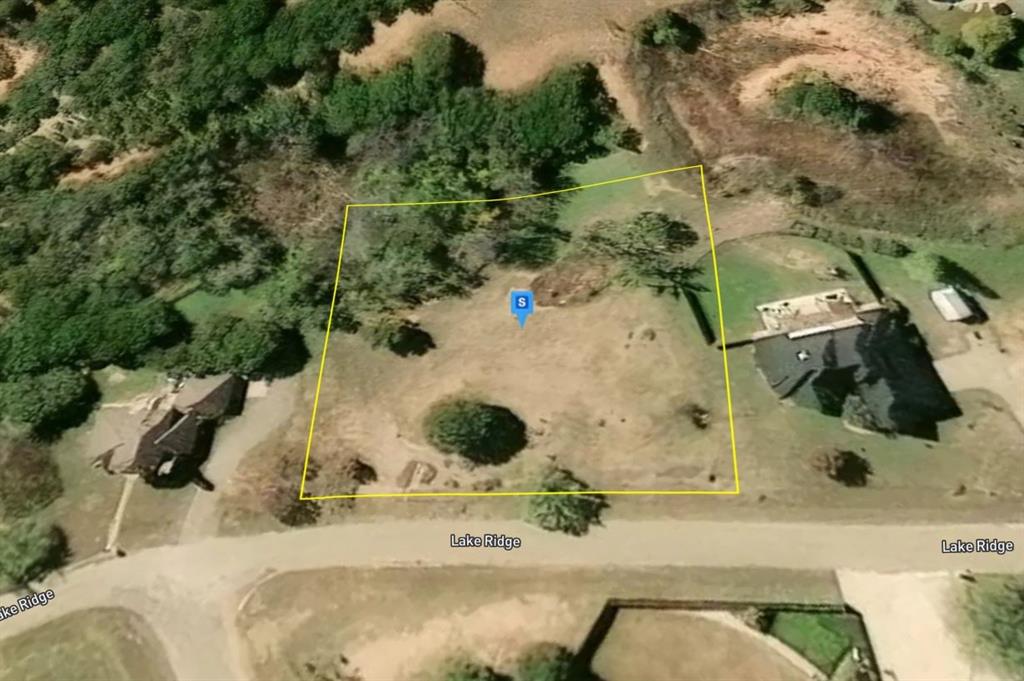 165 Lake Ridge Tuscola, TX 79562 - Photo 3 of 5 an aerial view of a house with a yard