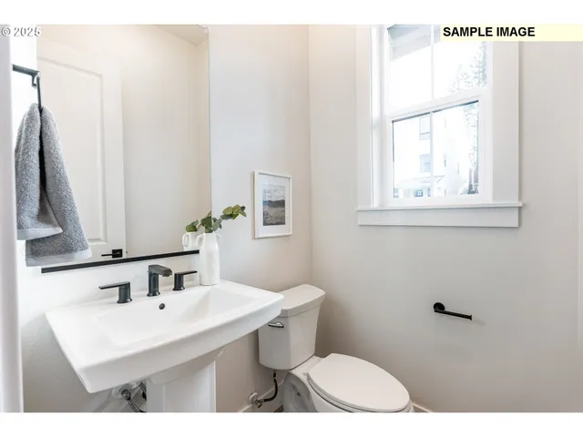 a bathroom with a sink double vanity and a mirror