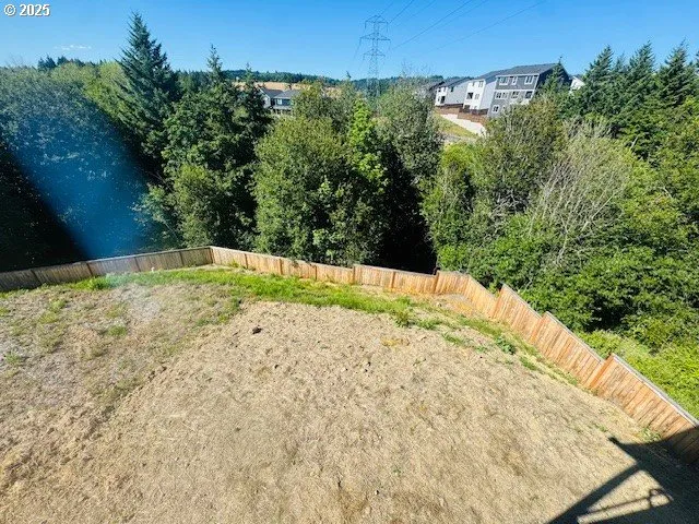 a view of a backyard of the house