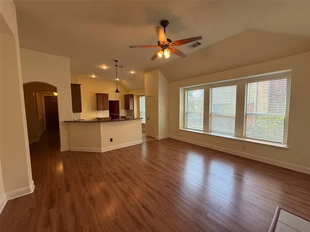 a view of a kitchen with a sink and a window