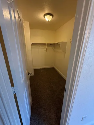 a view of storage and utility room with a sink