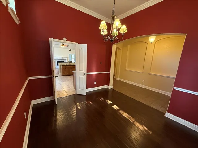 a view of room with window and wooden floor