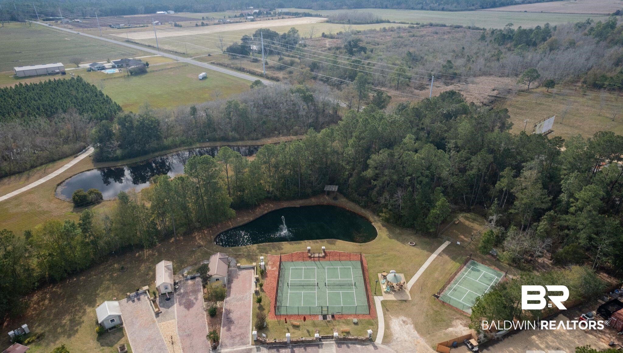12041 Raptor Court Elberta, AL 36530 - Photo 21 of 32 Aerial view of property's location featuring a large body of water and a tree filled landscape