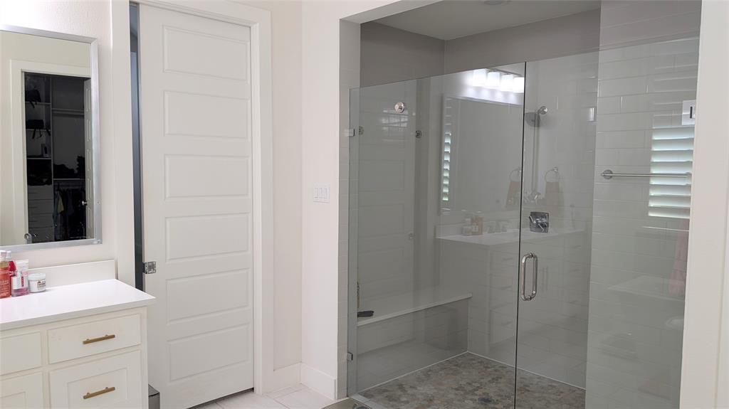 8933 Frostweed Road Frisco, TX 75035 - Photo 17 of 36 a bathroom with a shower sink and mirror