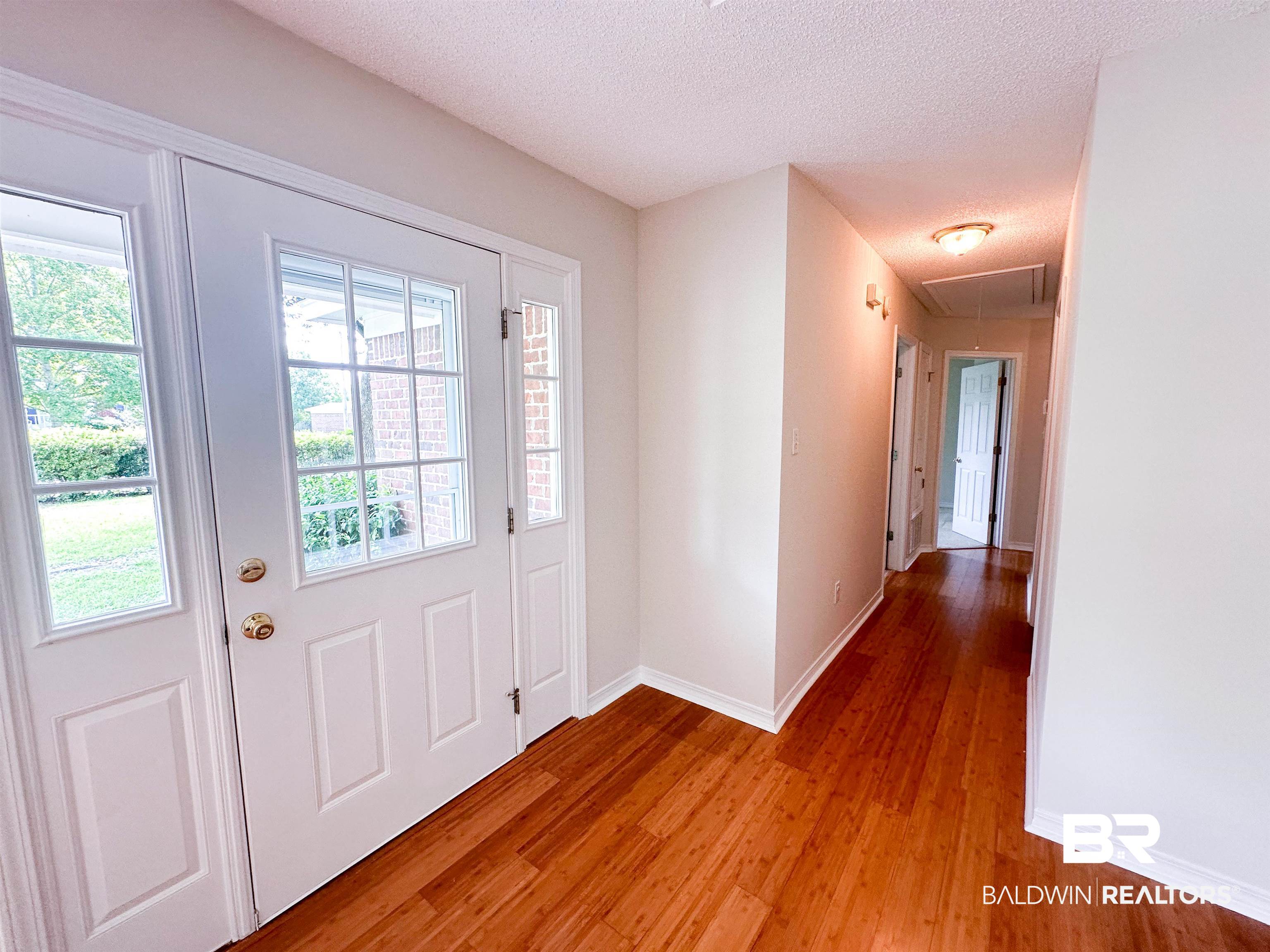 13255 Pointer Drive West Foley, AL 36535 - Photo 14 of 25 Entryway with hardwood / wood-style flooring and a textured ceiling