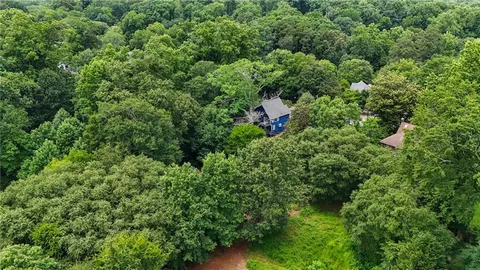 a view of a house with a tree