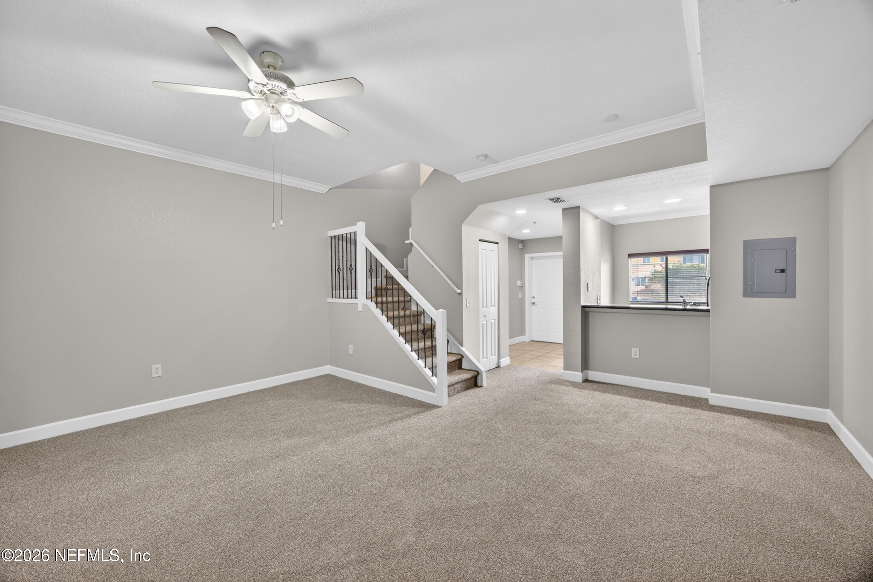 9745 Touchton Road, Unit 1224 Jacksonville, FL 32246 - Photo 8 of 22 a view of an empty room with a chandelier fan