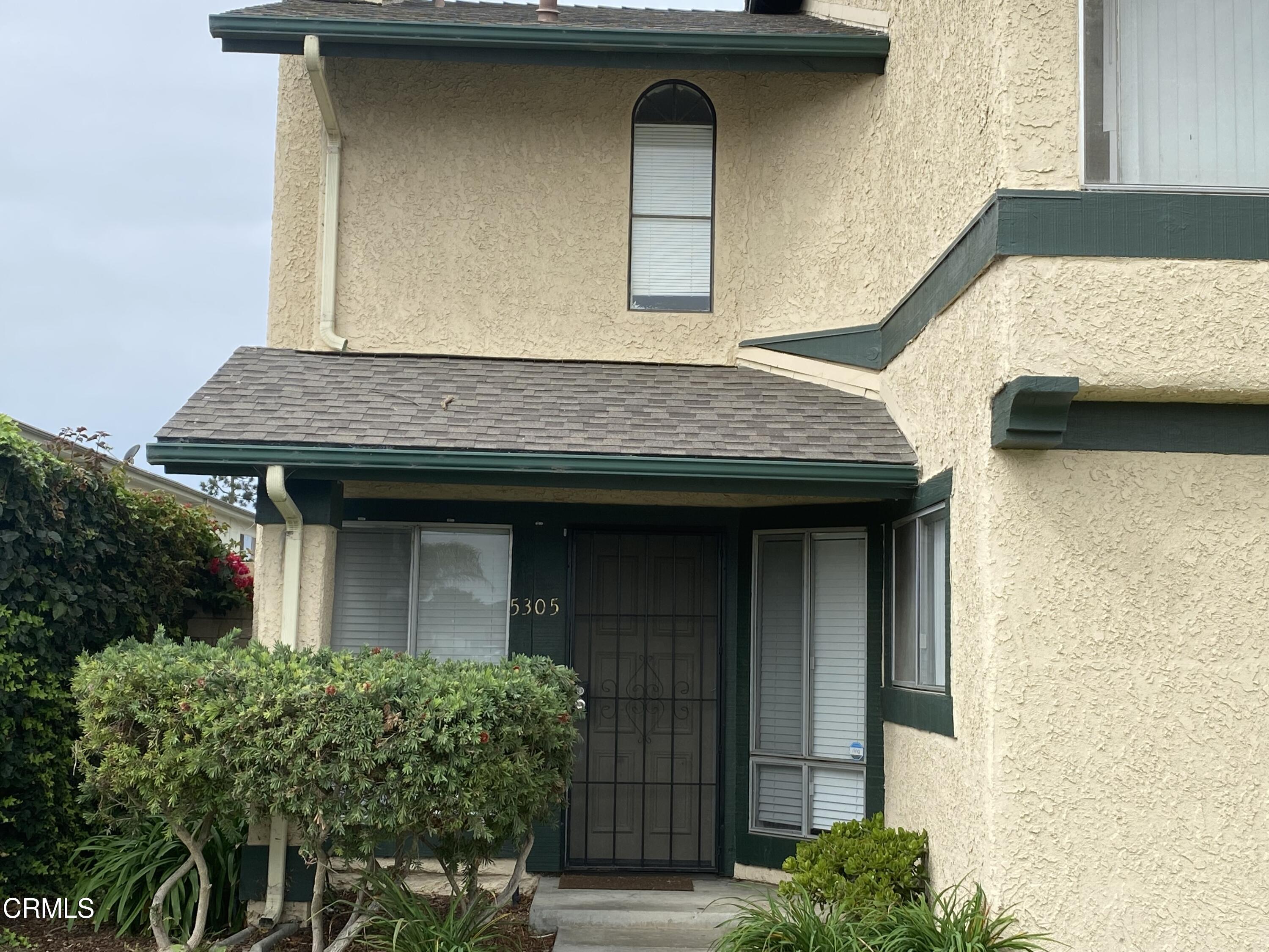 5305 Perkins Road Oxnard, CA 93033 - Photo 1 of 23 a view of a wooden door of the house