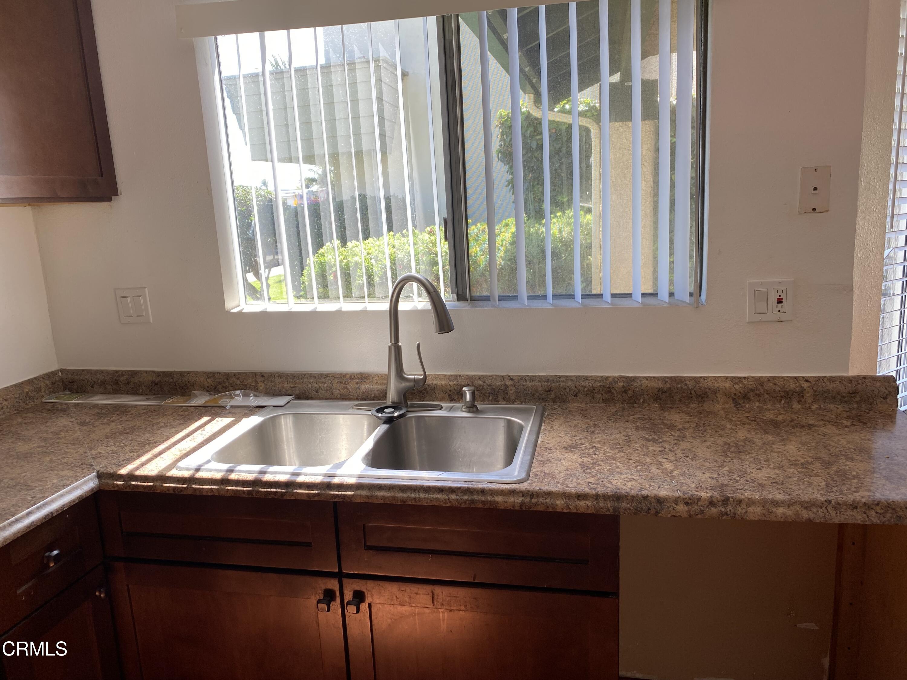 5305 Perkins Road Oxnard, CA 93033 - Photo 7 of 23 a kitchen with granite countertop a sink and a granite counter tops