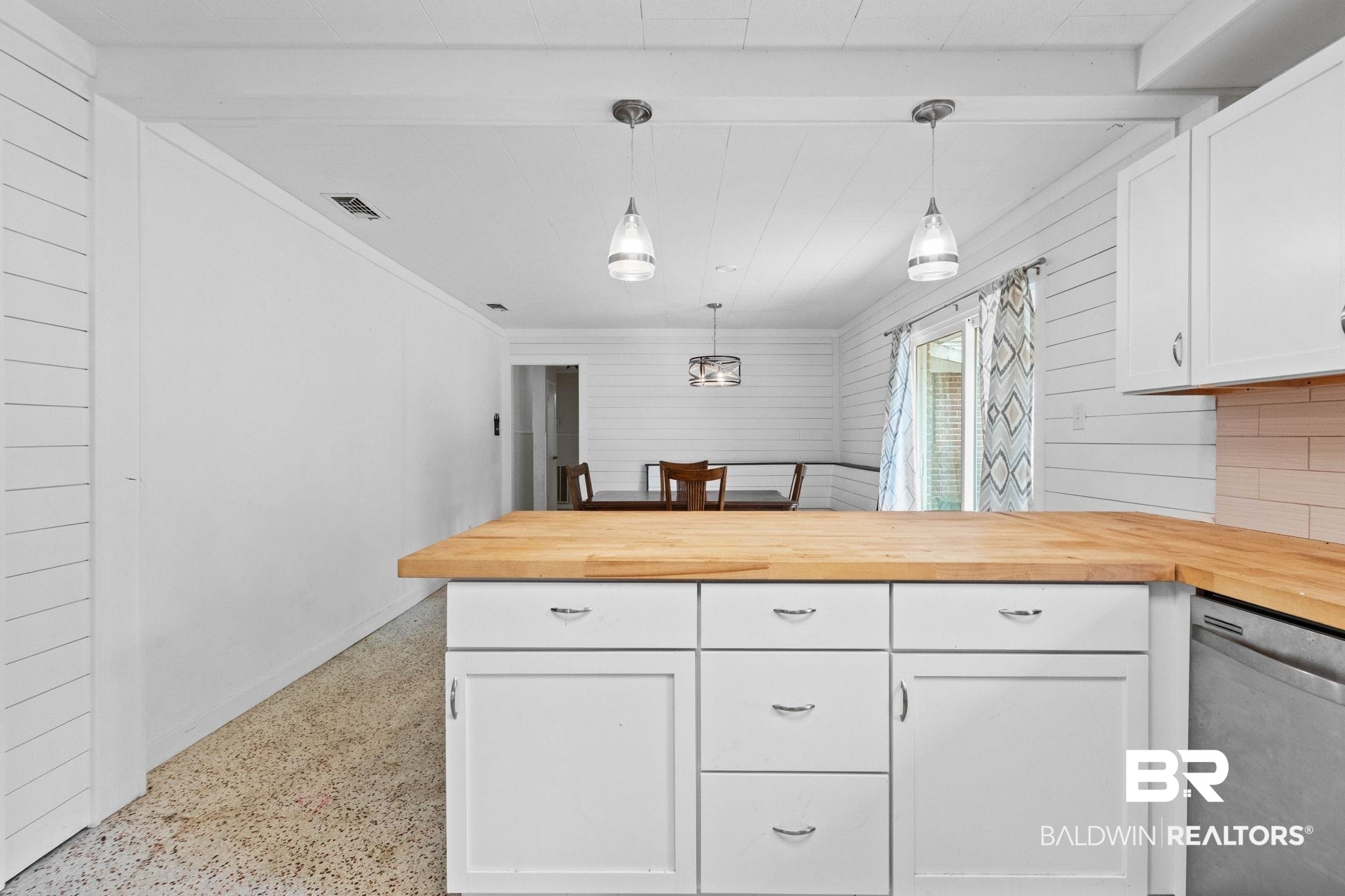 384 Old Bratt Road Atmore, AL 36502 - Photo 25 of 64 White cabinetry with butcher block countertops, recessed lighting, and a subway tile backsplash