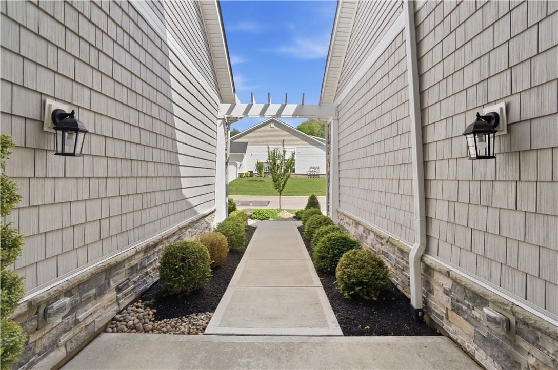 605 Cape Cod Court Beavercreek, OH 45430 - Photo 4 of 54 This inviting walkway welcomes you home, showcasing classic architectural details and manicured landscaping.