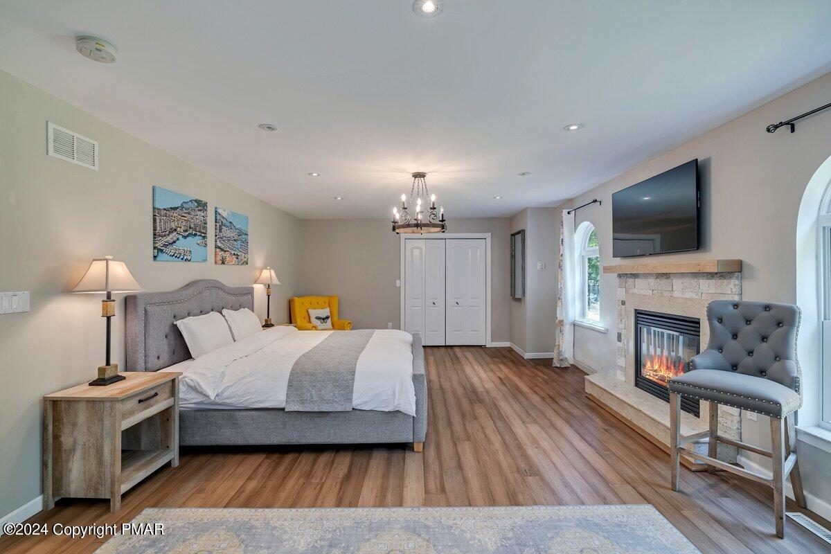 2175 Longview Drive Bushkill, PA 18324 - Photo 16 of 50 a bedroom with furniture and a fireplace