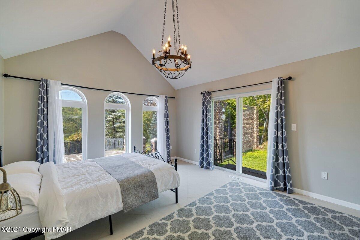 2175 Longview Drive Bushkill, PA 18324 - Photo 21 of 50 a bed sitting in a bedroom next to a window