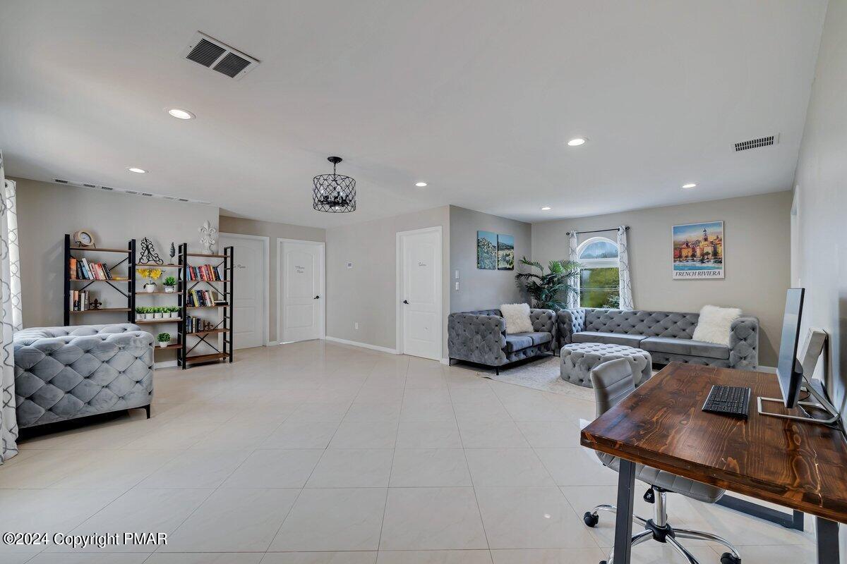 2175 Longview Drive Bushkill, PA 18324 - Photo 27 of 50 a living room with furniture and a couch