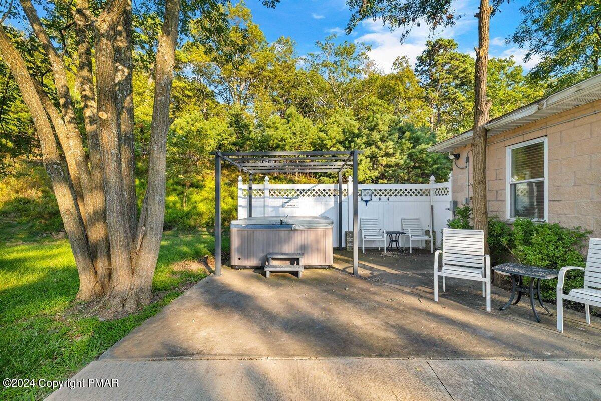 2175 Longview Drive Bushkill, PA 18324 - Photo 38 of 50 a view of a backyard with a table and chairs under an large trees