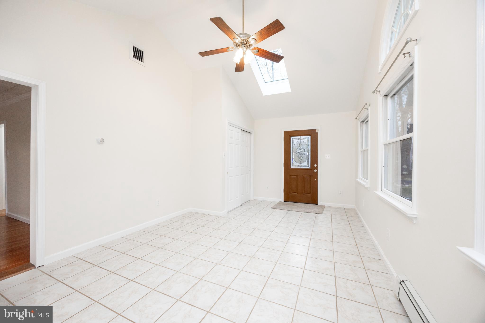 5816 Upper Ridge Road Pennsburg, PA 18073 - Photo 13 of 71 a view of an empty room with window and chandelier fan
